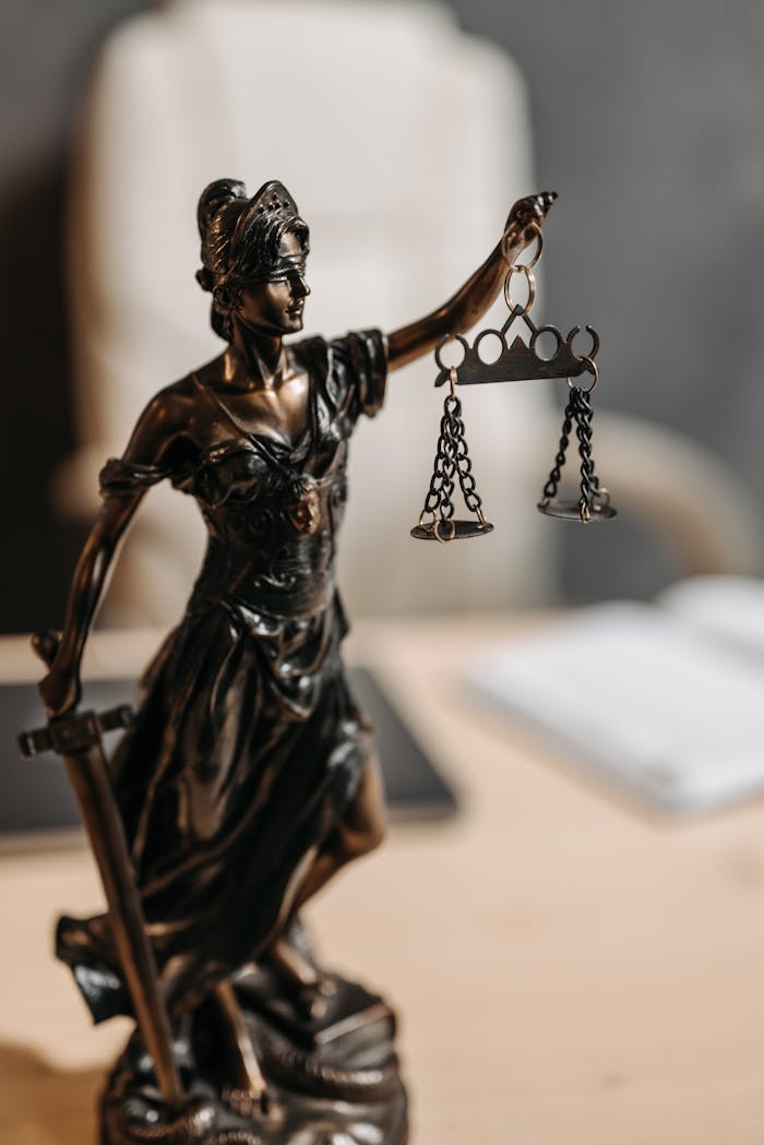 Mastering the First Impression: Your intriguing post title goes here Bronze Lady Justice statue with scales and sword, symbolizing fairness and law.